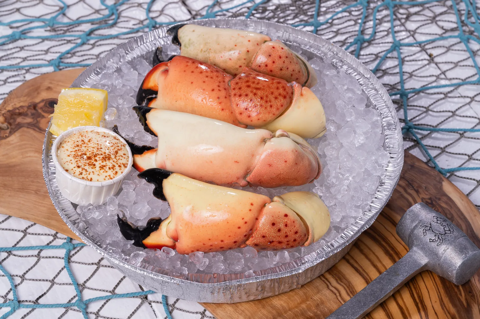 Florida stone crab claws on ice with mustard sauce
